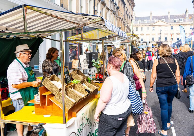The Great Bath Feast in Milsom Street in 2021. Food stallholders speak to visitors.