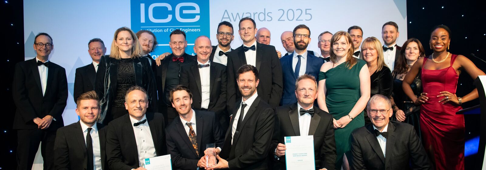 People are pictured with three prizes at the ICE awards.