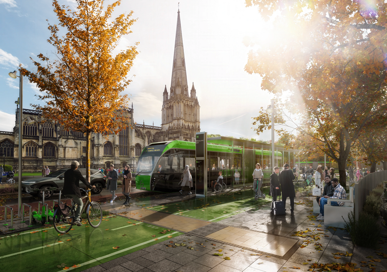 green bus, cyclist and pedestrians
