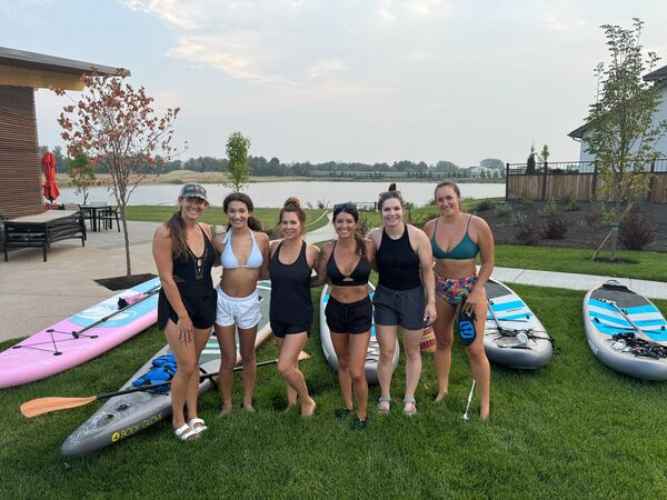 group of women going paddleboarding