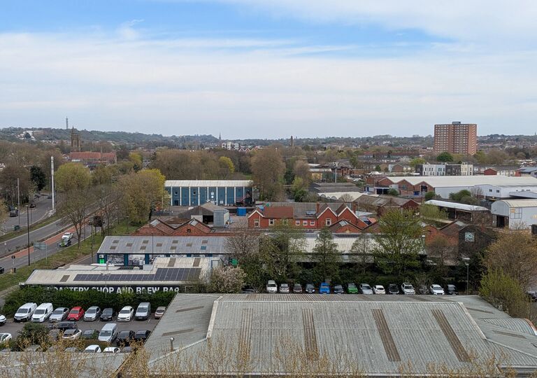 view of rooftops and parked cars in bristol